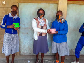 Students receive meal from their teacher