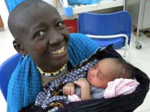 A proud new mother displays her beautiful baby