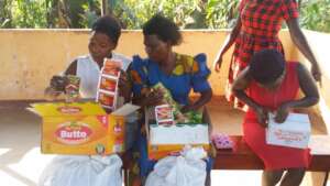 Women receive their shop items