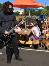 Jeff playing guitar at the annual dog wash