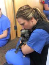 Sam comforts a hospital employee
