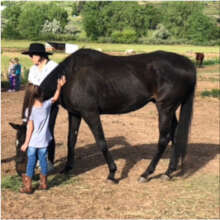 Rajah w/volunteer Krista and a program participant