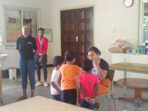 The children looking at drawings of sea turtles