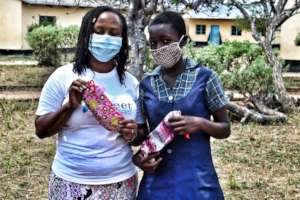 Panashe receiving her reusable sanitary pads...