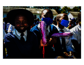 School girls receiving reusable cloth pads.