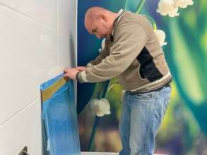 Karol will be hanging a mirror in the bathroom.