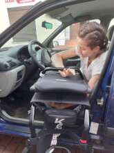Emilia while learning to drive a car.