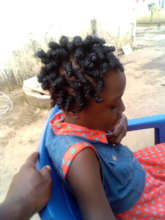 Esther is enjoying her plaited hairstyle by Regina