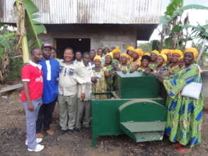 Women beneficiaries with old cassava grinder
