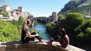 Older and younger sister sightseeing in Mostar