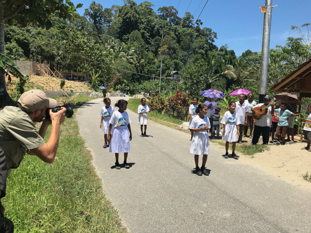 Filming local kids performing a cockatoo dance