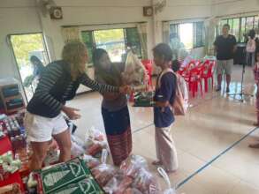 Giving food packet to an orphan