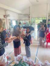 Giving food packet to an orphan