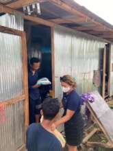 A smile lights up on one Burmese migrant worker.