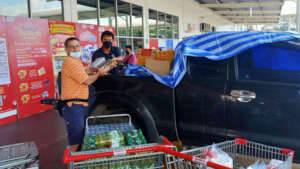 Buying food from the market for distribution