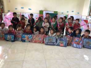 Presenting gifts to students in Ban La