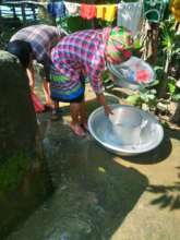 Teachers and parents are washing kitchen utensils