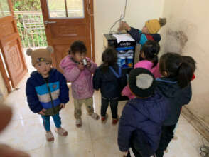 Children drinking water from the water purifier