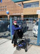 Parent in line waiting to receive assistance