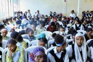 High School Students accepting dignity kit