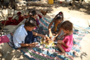 Children eating a delicious hot meal.