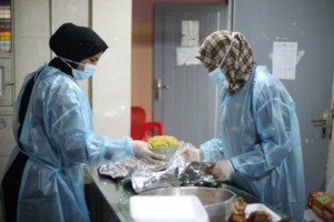 Alaa' & Heba cooking meals in the kitchen