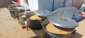 Huge pots of food are cooked for the families