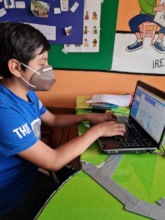 Boy tutoring from developing country