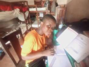 Homework time at Chez Papa Geoff, Benin