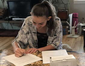 teen girl signing contract for pornonograhy