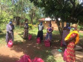 Caregivers with their food packets