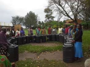 Grandmothers with water harvesting tanks