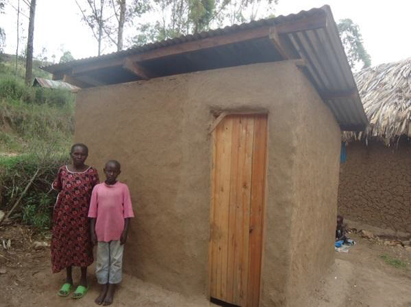 Florence and Marvin with their new pit latrine