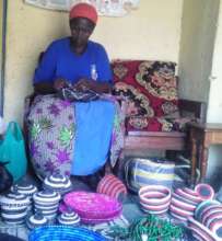 Baraba with some of her handmade baskets