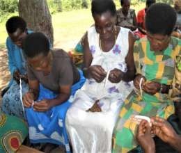 Exchange visit on how to make beads and weave