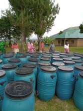 Grandmothers Receiving Water Harvesting Tanks