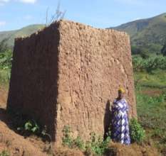 Veneranda in front of her kiln of bricks