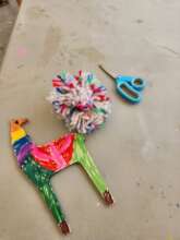 Decorated llama with a finished pompom