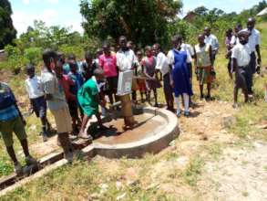 Kids testing refurbished Kiwafu Village Well