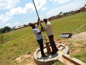 Workers fixing well
