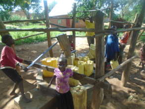 Kids Collecting Well Water