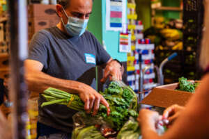 NYCP Volunteer packing produce