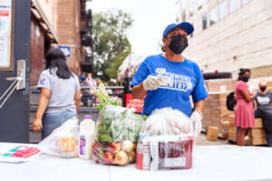 NYCP Volunteer distributing Pantry packages