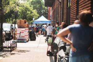 Participants waiting in line for food distribution