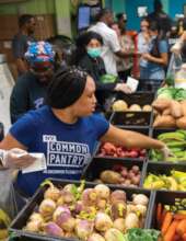 Volunteer packing a Pantry package