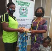 Our staff presenting food items to Olaitan's aunt