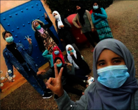 Khadija poses with Project Soar girls.