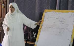 chairperson introducing pilot program