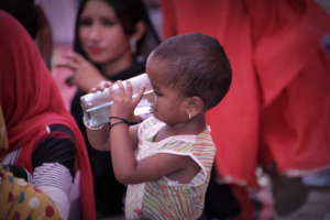 fresh meal boxes and water distributed to children