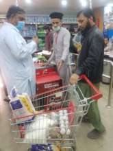 Muwakhat team purchasing grocery for Nabila